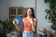 Exhausted woman suffers from heat fanning with paper fan. Stressed overheated girl sweating suffocating from seasonal abnormal summer temperature, stuffiness, trying to cool down, relief discomfort.