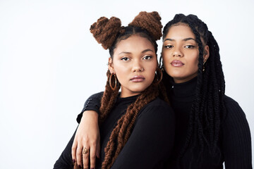Wall Mural - Attitude, confident or portrait of black woman with sister in studio on white background for beauty. Braids, face and family with serious sibling people together for cosmetics, support or love