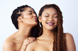 © peopleimages.com - Friends, skincare and women in studio for beauty, wellness and dermatology on white background. Friends, salon aesthetic and face of African people happy for natural glow, healthy skin and spa
