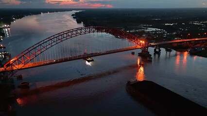 Wall Mural - aerial view of a coal barge passing through a South Kalimantan river