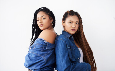 Poster - Portrait, sister and women with fashion in studio with hairstyle, confidence and cool attitude. Face of African people, girl or model with braids and denim for trendy clothes on white background