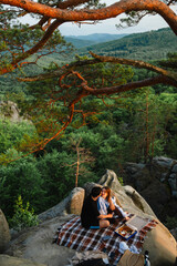 Poster - happy couple having date at the cliff on sunset