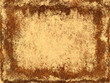 Bright colorful stains of brown and yellow colors on retro paper texture. Splatter pattern on paper background. Horizontal or vertical backdrop with smeared paint