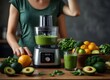 Woman is preparing a healthy detox drink in a blender - a green smoothie with fresh fruits, green spinach and avocado. Healthy eating concept, ingredients for smoothies on the table, top ... See More

