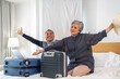 Senior elderly asian couple use laptop for hotel and resort booking online summer holiday travel planning searching information weekend vacation trip.reservation online, senior retirement concept