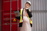 Fototapeta Tęcza - Portrait Happy caucasian logistic engineer pregnant woman working at container site	