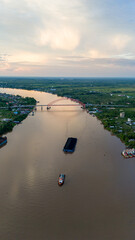 Wall Mural - aerial view of a coal barge passing through a South Kalimantan river