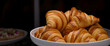 Homemade mini croissants on white plate in buffet line. Fresh Baked Buttery Croissants.