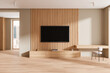 Wooden hotel interior with workspace, tv display and panoramic window