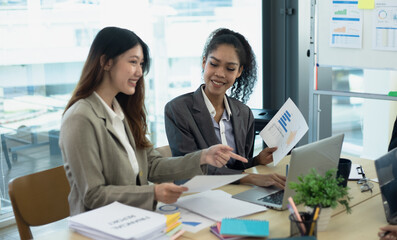 Wall Mural - Team of Asian business people and working together in office, Startup projects and business presentation.