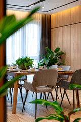 This image captures a modern dining space enhanced by natural light and green plants, epitomizing contemporary decoration and interior photography with a hint of deco