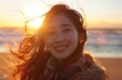 © AIGen - Women In Sun. Young Asian Woman Enjoying Winter Wind on Beach at Sunset