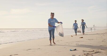 Wall Mural - Cleaning, volunteer and team of women, beach and gloves for recycling, waste and outdoor in nature. Collaboration, group and female people, ready and helping environment, trash and litter in sea