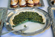 Quiche of spinach on silver plate