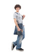 young man smiling and handsome dressed in jeans and t-shirt with shoulder bag isolated on white background