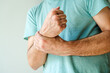 Severe rheumatic wrist pain symptoms, man with painful medical condition
