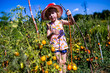 joy of gardening: a girl gathering sun-ripened tomatoes from the vine.