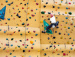 Man practicing Rock climbing wall bouldering Indoor Active lifestyle