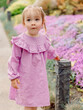 Portrait of beauty child girl in blooming summer garden or park.