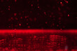 Abstract Red Particles Floating Above Reflective Surface