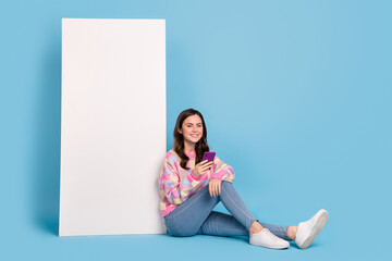 Wall Mural - Full size photo of young pretty girl use mobile download share speed connection 4g isolated over blue color background