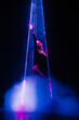 Gorgeous woman under colorful illumination, laser light, neon smoke club. Projection illusion mapping. Futuristic model.