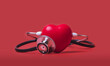 Red heart shape  exercise ball with doctor physician's stethoscope on red background, hospital life insurance concept, world heart health day. doctor day, world hypertension day,