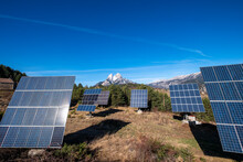 A Collection Of Solar Panels Is Effectively Juxtaposed With The Iconic Pedraforca Mountain, Symbolizing A Sustainable Future In The Region Of Catalonia, Spain