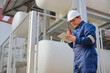 © Narin Sapaisarn - Portrait of professional man engineer working checking work place to keep liquid helium in industry.