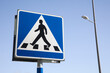© Patrick Bay Damsted - Swedish pedestrian crossing sign on blue sky