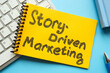 Story-driven marketing. The notepad is on the keyboard.