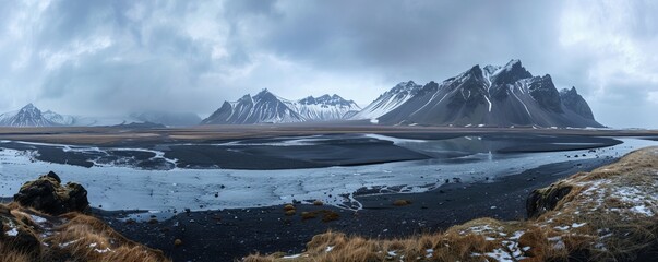 Wall Mural - Mountains, water and black sand in Iceland.