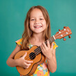 Portrait of little girl learning to play ukulele