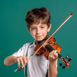 Portrait of little boy learning to play classic violin