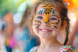 Cute little girl with tiger aqua makeup