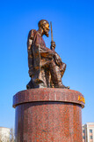 Fototapeta Na drzwi - Statue of the Uzbek poet Ajiniyaz Kosibay Uli on the public square in front of the Nukus Museum of Art or Igor Savitsky Museum in the capital of Karakalpakstan, western Uzbekistan, Central Asia