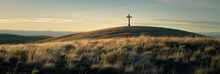 A Single Wooden Cross Stands Atop A Gentle Hill, Bathed In The Golden Light Of The Setting Sun, Evoking Peace And Solitude