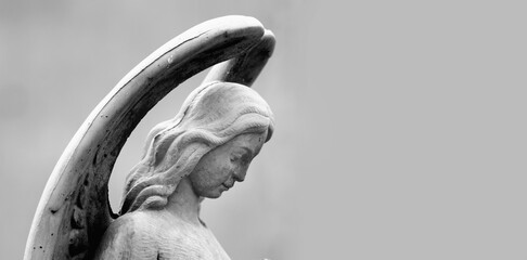 Wall Mural - Antique statue of wonderful angel. Black and white vertical image. Copy space.