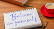  Notepad on a desk - Believe in yourself