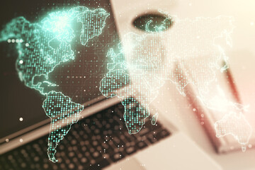 Wall Mural - double exposure of abstract digital world map on laptop background, research and strategy concept