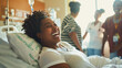 Black woman laughing with family before surgery in hospital - Health care and medical concept - Models by AI generative