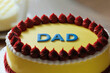 Cake for father's day. Yellow cake with dad word. Happy father's day concept. men's cake