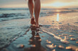 © amavcoffee - a pair of legs walking barefoot across a beach shore