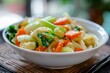 Indonesian dish called capcay stir fried mixed vegetables in white bowl influenced by Chinese cuisine Contains carrot cauliflower pak choi napa cabbage