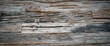 Old gray wooden texture. Weathered wooden background with seamless inclusions and cracks.