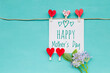 Mother's day card with red heart clip and flower on blue background, Happy mother's day card background idea