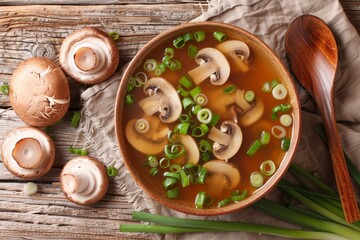 Sticker - Overhead view of Japanese soup with shiitake mushrooms and green onions in a bowl on table