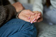 Close Up Of Mother Holding Hands With Teenage Daughter With False Nails Providing Love, Support And Advice