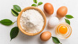 Wheat flour and chicken eggs on light cooking background. Culinary and baking concept. Flat lay.