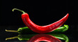 red and green chili peppers on a black background